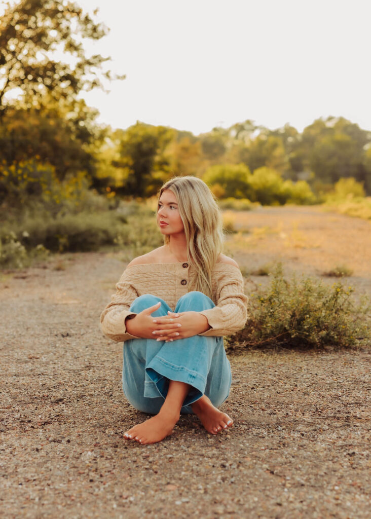 A Hollis High School Senior posing outdoors